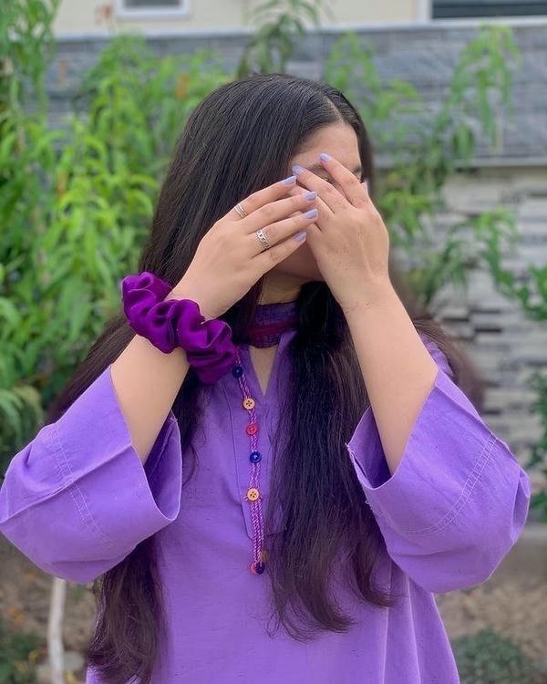 hidden face girl in field